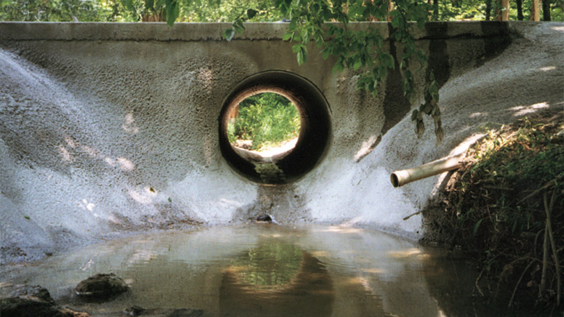 an image of a water culvert being repaired