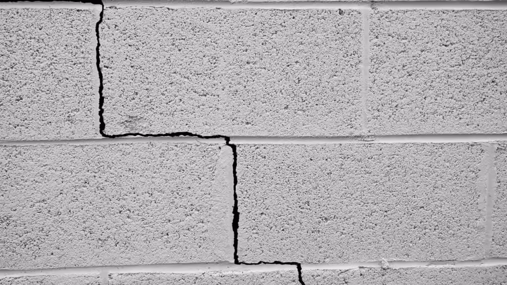 small crack in concrete brick wall
