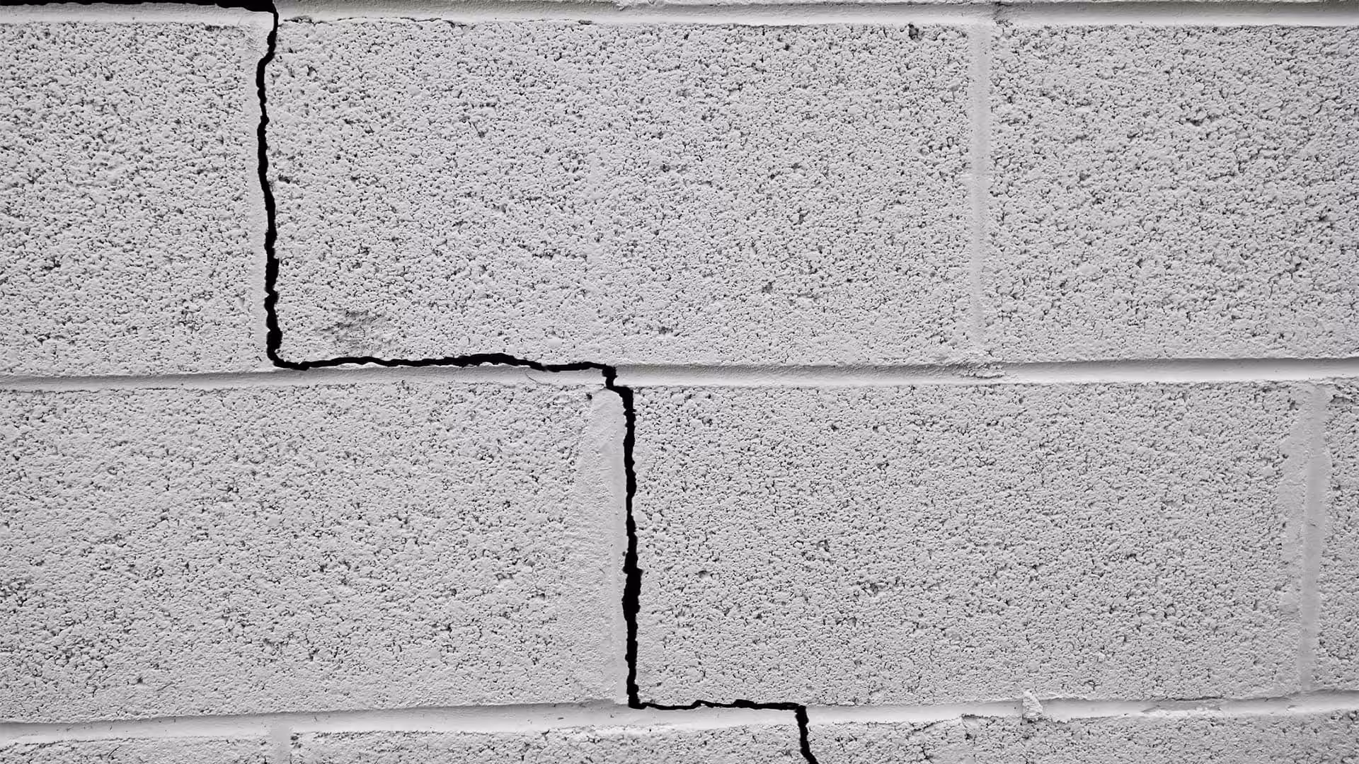 small crack in concrete brick wall