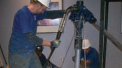 an image of two workers repairing in a dialysis clinic