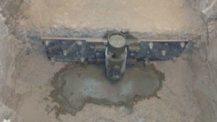 am image of a in ground anchor in a cement floor