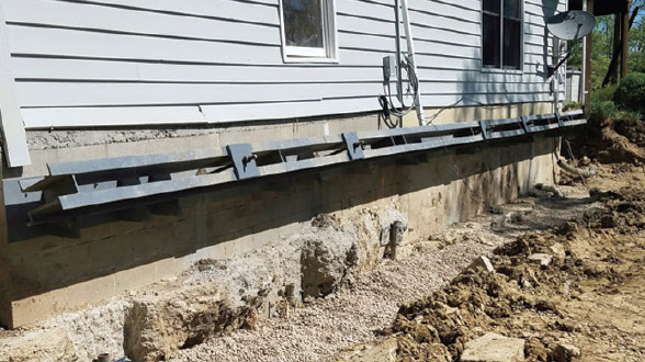 an image of a residential foundation being exposed