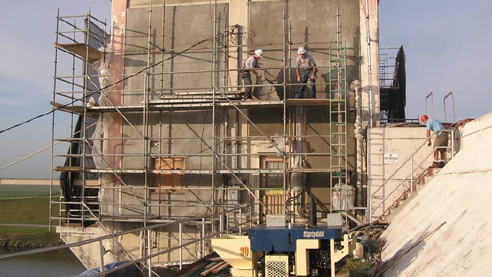 An image of the side of a commercial building with scaffolding