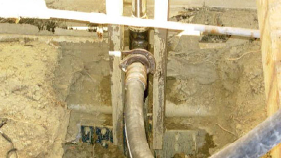 a close up of under a basement floor with a support