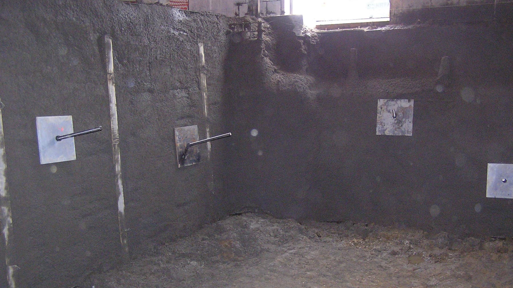 an image of soil nails into the sides of a commercial building